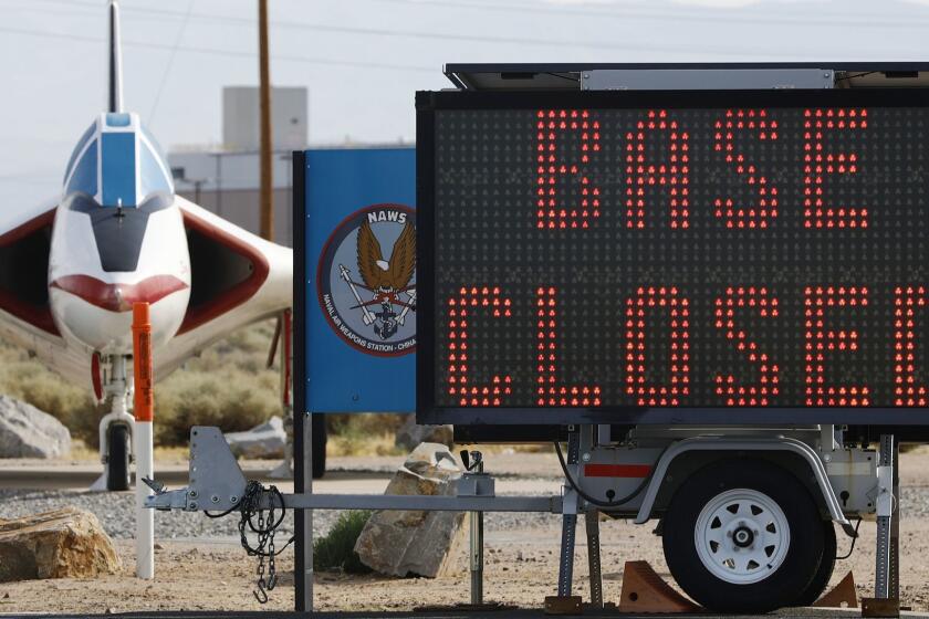 RIDGECREST, CALIFORNIA - JULY 07: A 'Base Closed' sign is posted outside the main gate to Naval Air Weapons Station (NAWS) China Lake on July 7, 2019 in Ridgecrest, California. NAWS China Lake is currently "not mission capable until further notice" following a series of earthquakes nearby. Non-essential personnel were authorized to evacuate the base due to infrastructure concerns. The base remains accessible only to mission essential personnel. (Photo by Mario Tama/Getty Images) ** OUTS - ELSENT, FPG, CM - OUTS * NM, PH, VA if sourced by CT, LA or MoD **
