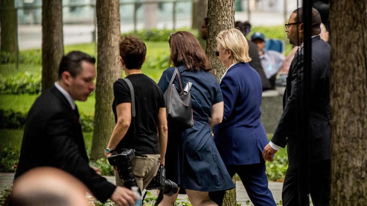 Hillary Clinton leaves a 9/11 commemoration in New York after feeling unwell.