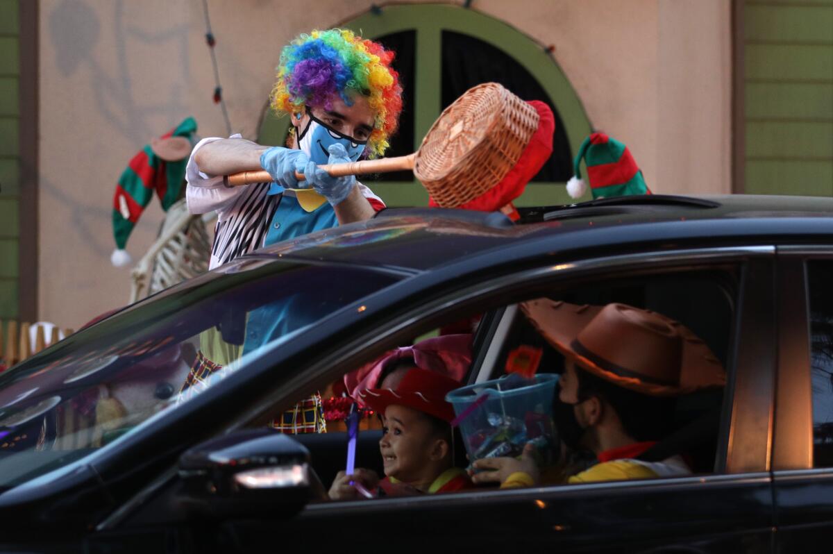 Performer AJ Danna pours candy through a sunroof at Haunt O' Tween LA. in Woodland Hills. 