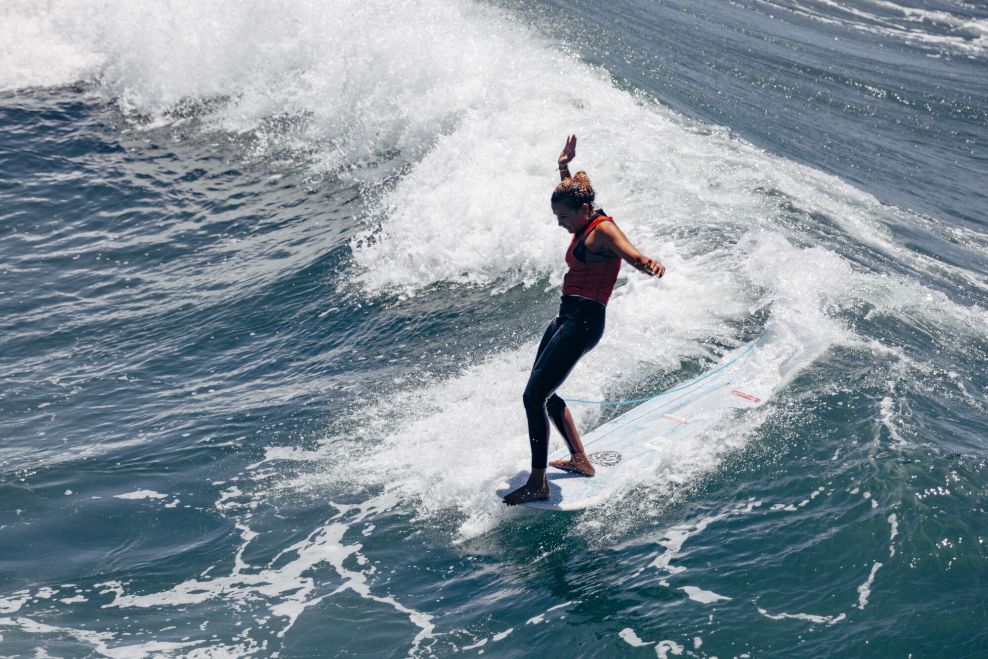 Alice Le Moigne competes in the women's longboard challenger series at the U.S. Open of Surfing.