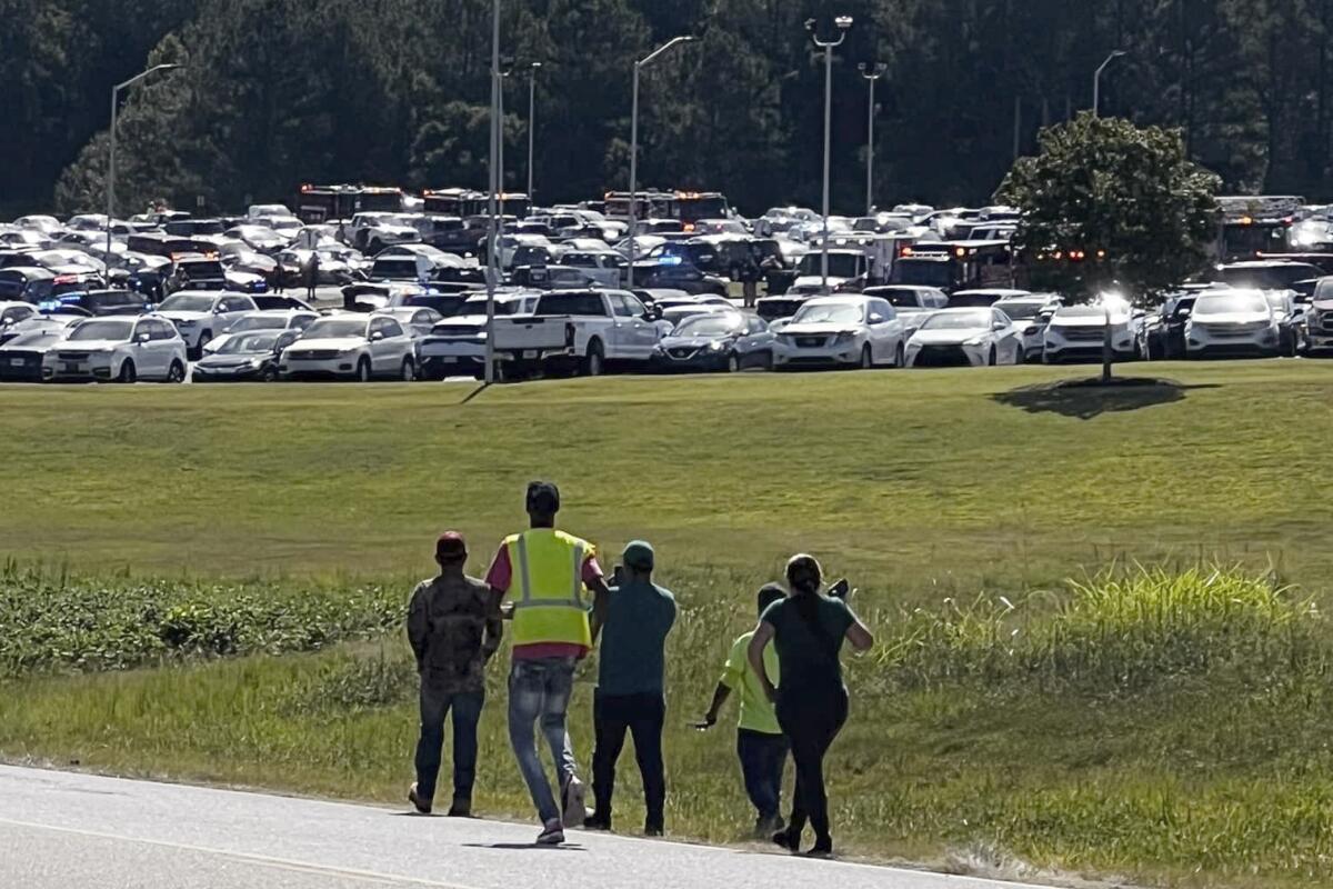 Students are evacuated from Apalachee High School in Winder, Ga., on Sept. 4, during a mass shooting. 