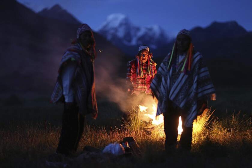 FILE - Andean farmers take part in a ceremony honoring Mother Earth and Father Snowy Mountain, in Pitumarca, Peru, April 4, 2018. U.N. member countries on Friday concluded a new treaty to help ensure that traditional knowledge about genetic resources – like medicines derived from exotic plants in the Andes mountains – is properly traced. (AP Photo/Martin Mejia, File)