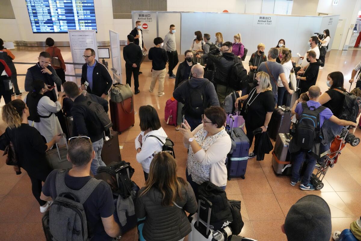 A crowded arrival area at Haneda International Airport in Tokyo