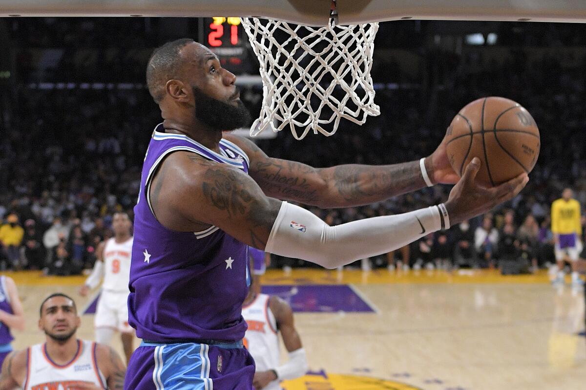 Lakers forward LeBron James elevates for a reverse dunk.