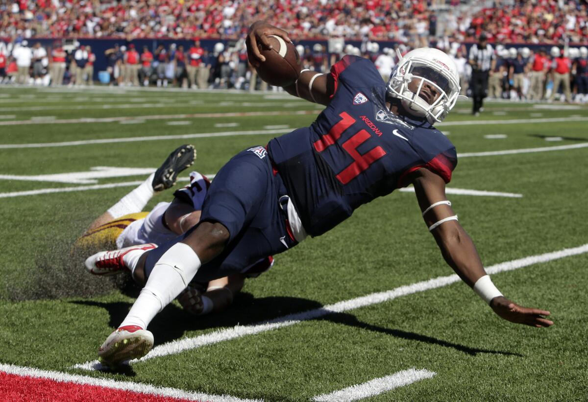 Arizona quarterback Khalil Tate is taken down by USC defensive end Porter Gustin during the first half of a game on Oct. 15.