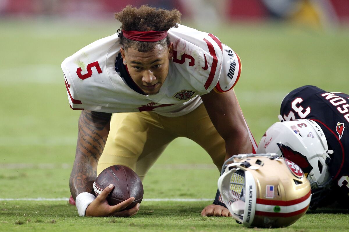 San Francisco 49ers quarterback Trey Lance (5) is tackled by Arizona Cardinals free safety Jalen Thompson (34) during the second half of an NFL football game, Sunday, Oct. 10, 2021, in Glendale, Ariz. (AP Photo/Ralph Freso)