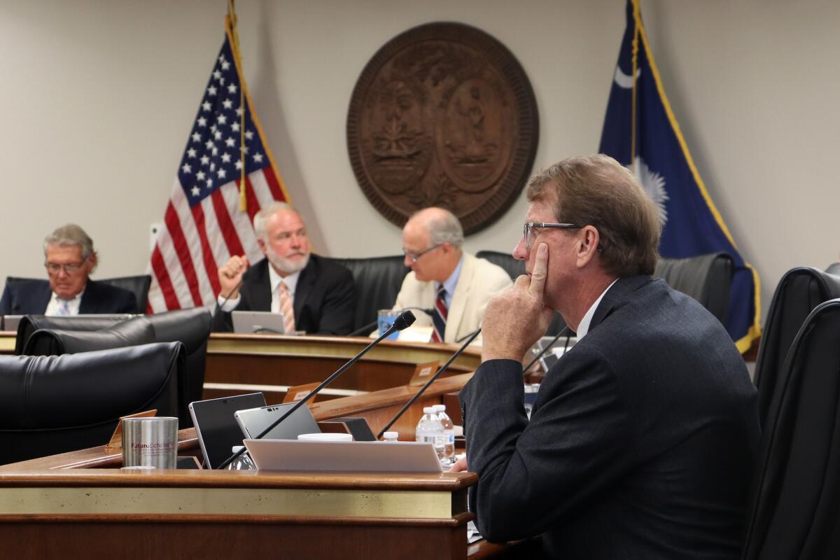 State Sen. Richard Cash, center, a leading supporter of South Carolina's recently implemented Fetal Heartbeat law banning abortion around six weeks, sits during a Senate Medical Affairs Committee meeting, Wednesday, Aug. 17, 2022, in Columbia, S.C. (AP Photo/James Pollard)