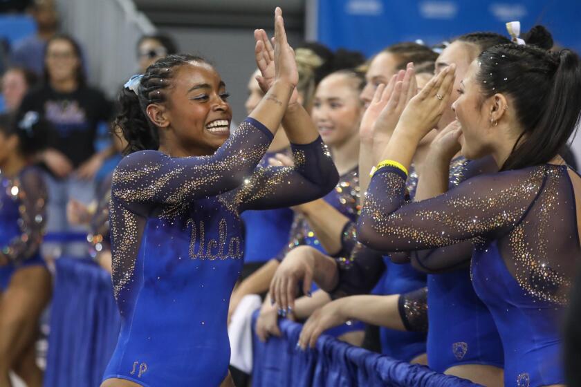 Los Angeles, CA - March 30: Selena Harris competes with UCLA gymnastics.