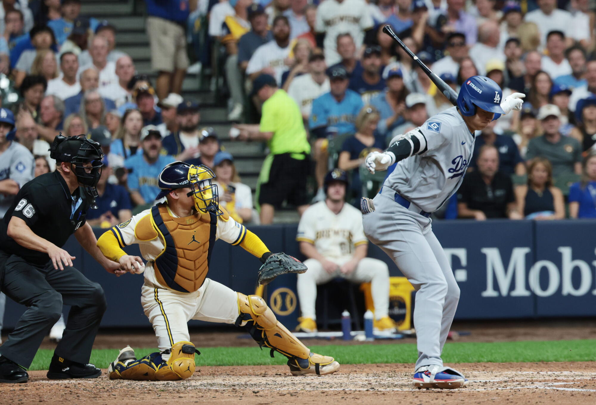 Dodgers designated hitter Shohei Ohtani strikes retired during the sixth inning of Game 2 of the NLCS against the Brewers.
