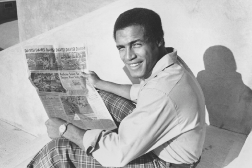 USC running back Anthony Davis holds a newspaper telling of his six touchdowns against Notre Dame on Dec. 6, 1972.