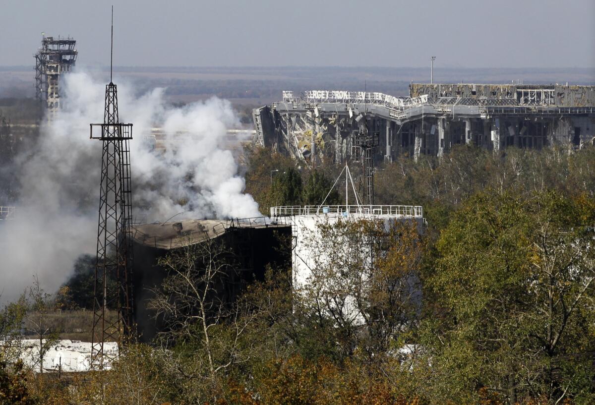 Smoke rises from the artillery-battered facilities at Donetsk's international airport on Oct. 3 as fighting between Ukrainian troops and pro-Russia separatists intensified.