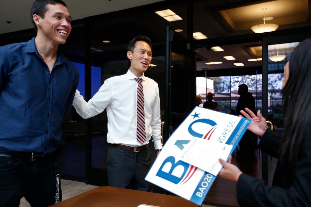 Bao Nguyen, 36, center, mayor of Garden Grove, speaking to supporters before the start of a watch party featuring a live stream of comments by Sen. Bernie Sanders of Vermont.