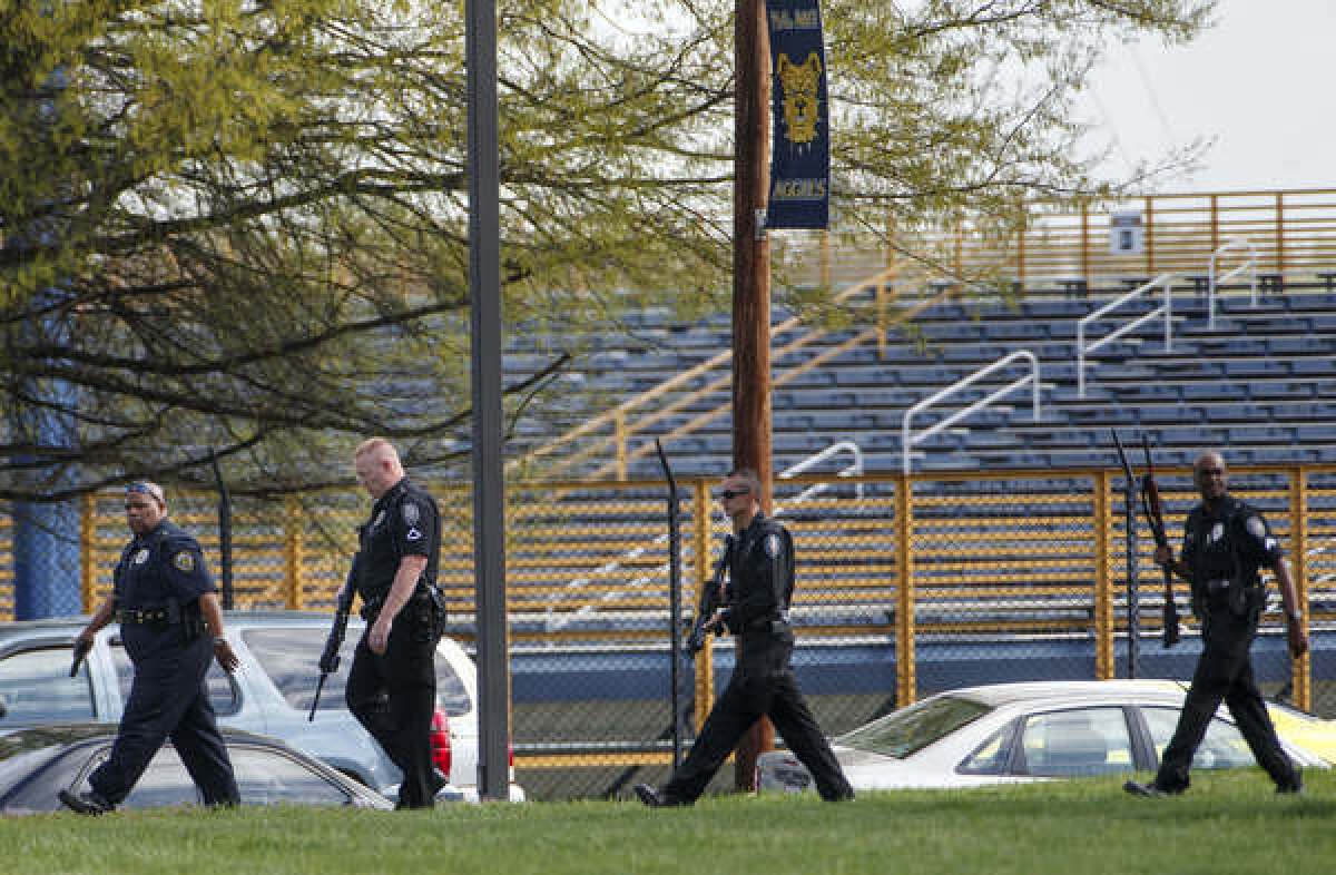 Greensboro and North Carolina A&T; University police search the campus after a report of a man with a rifle in the area were received Friday.