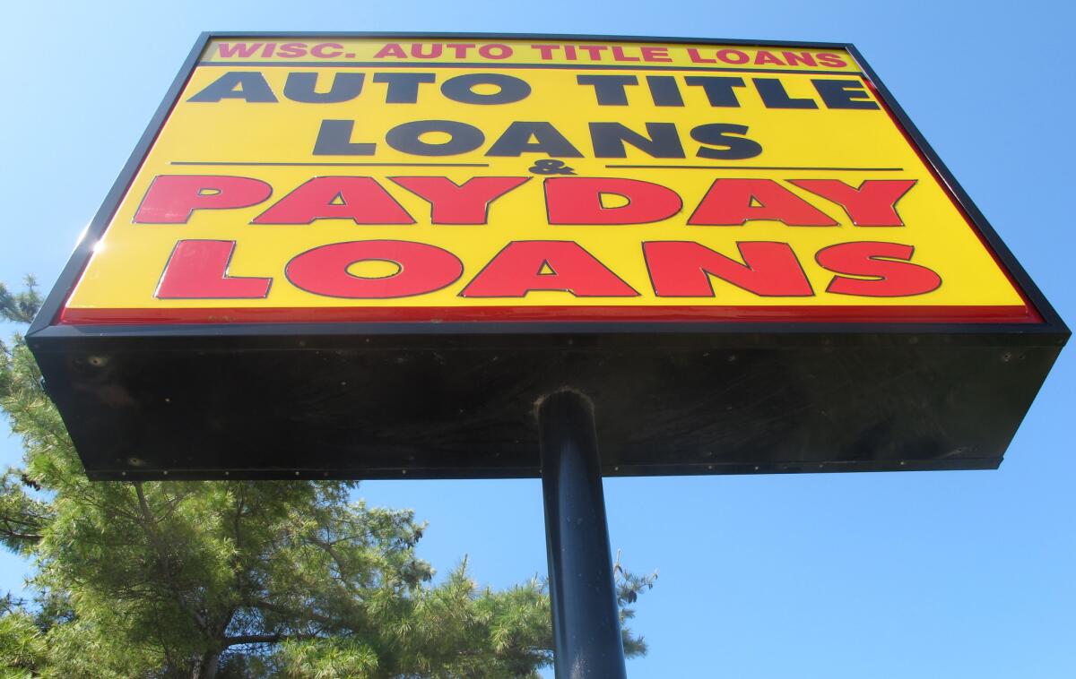 A sign for a Auto Title Loans store in Madison, Wis.