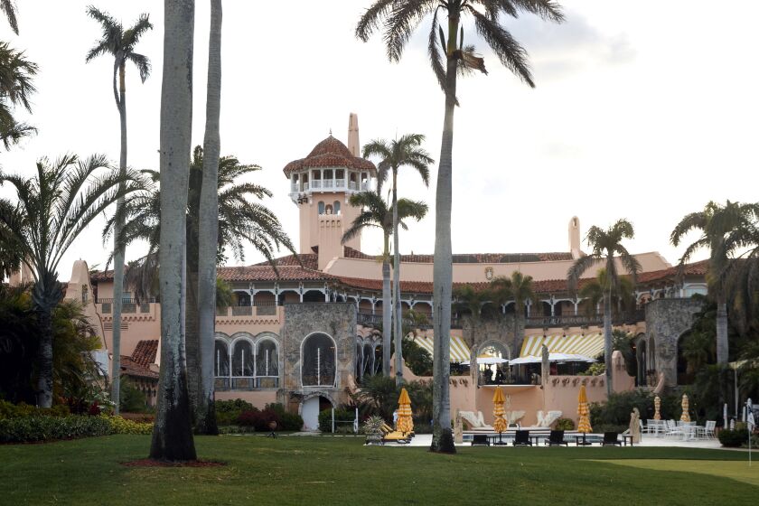 FILE - President Donald Trump's Mar-a-Lago estate is seen from the media van in the presidential motorcade in Palm Beach, Fla., March 24, 2018, en route to Trump International Golf Club in West Palm Beach, Fla. The FBI search of Donald Trump’s Florida estate has spawned a parallel special master process that this month slowed down a criminal investigation and exposed simmering tensions between Justice Department prosecutors and lawyers for the former president. The probe into the presence of top-secret information at Mar-a-Lago continues. (AP Photo/Carolyn Kaster, File)