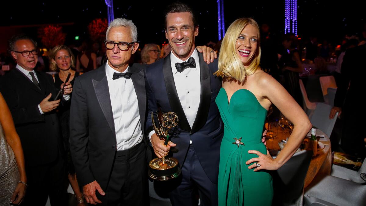 Winner Jon Hamm, center, hit the Governors Ball after the Emmys with "Mad Men" costars John Slattery and January Jones.