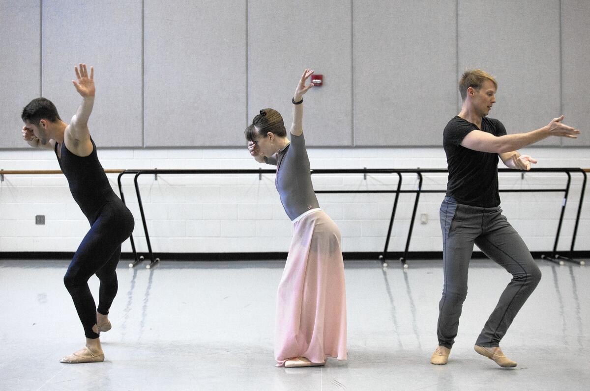 Dancers, from left, Dustin True Ashley Lynn and Evan Swenson rehearse a choreography by instructor Sarah Tallman, not pictured.