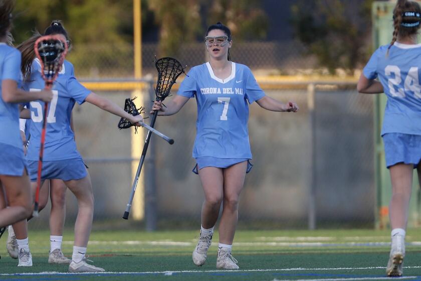 Corona del Mar High's Caroline Brewster (7) is congratulated by teammates after she scored against Edison during the first half in a Sunset League game at Edison High on Thursday, March 14, 2019.