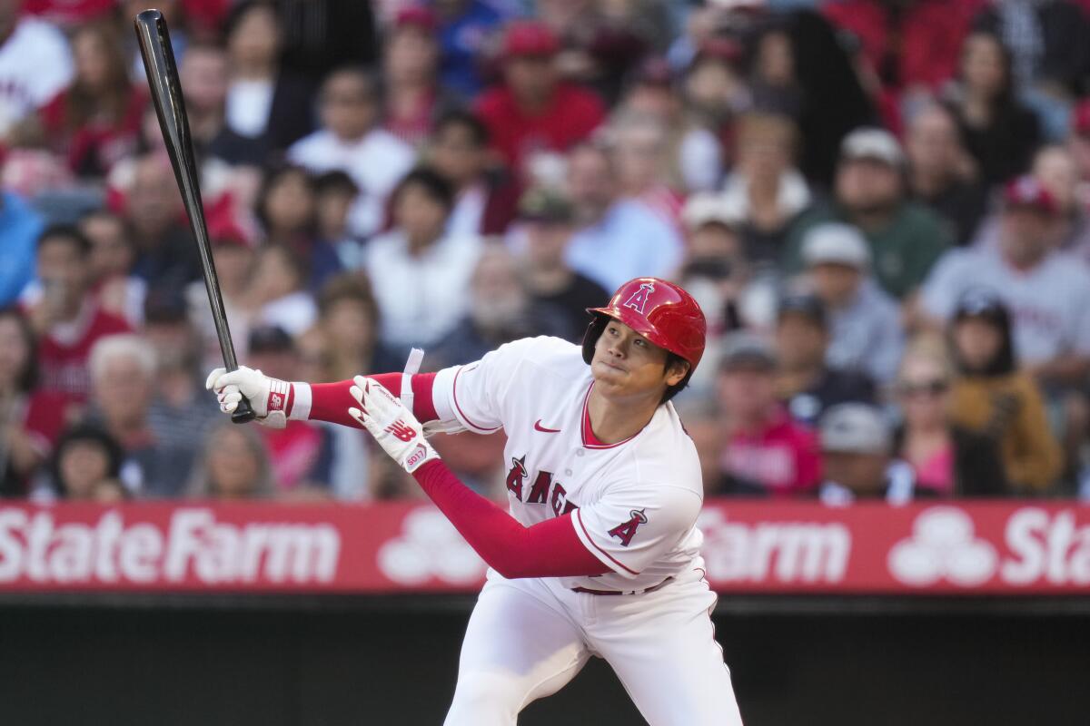 Shohei Ohtani flies out to left field during the first inning against the Texas Rangers on Saturday at Angel Stadium.
