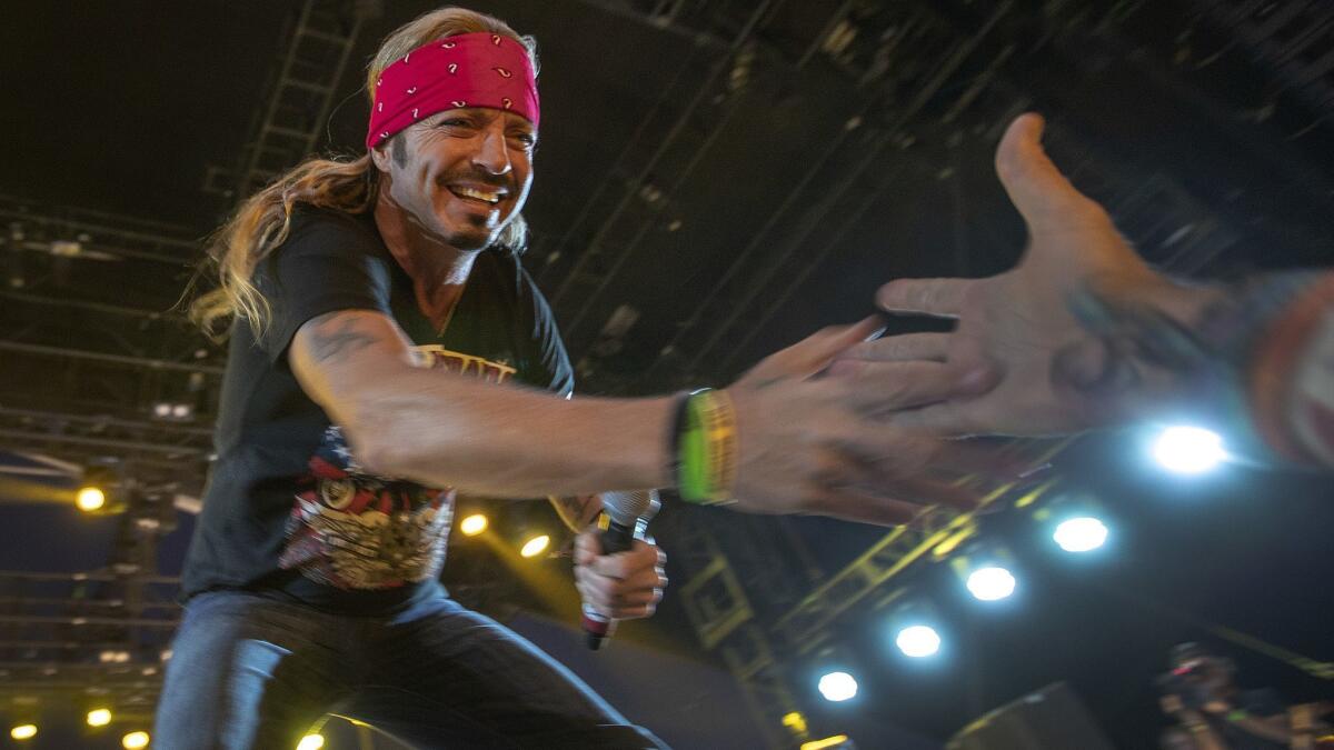 Hard rocker turned country singer Bret Michaels greets a fan on the Palomino stage Friday at the 2019 Stagecoach Country Music Festival in Indio.