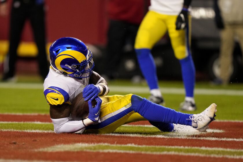 Los Angeles Rams safety Nick Scott intercepts a pass in the end zone during the second half of an NFL football game against the Kansas City Chiefs Sunday, Nov. 27, 2022, in Kansas City, Mo. (AP Photo/Charlie Riedel)