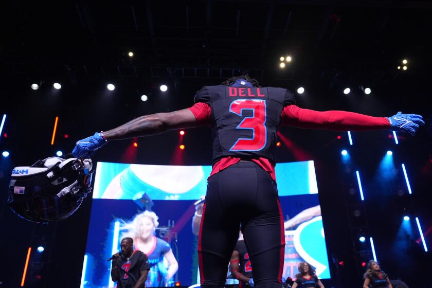 Houston Texans wide receiver Tank Dell wears a new uniform during an NFL football uniform release party Tuesday, April 23, 2024, in Houston. (AP Photo/David J. Phillip)