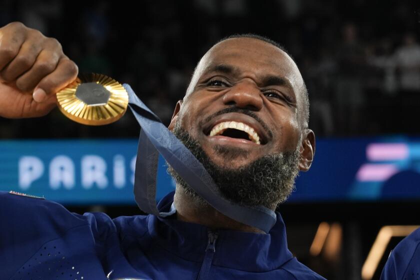 United States' LeBron James (6) celebrates after beating France to win the gold medal during a men's gold medal basketball game at Bercy Arena at the 2024 Summer Olympics, Sunday, Aug. 11, 2024, in Paris, France. (AP Photo/Rebecca Blackwell)