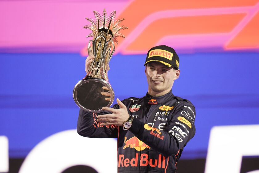 Red Bull driver Max Verstappen of the Netherlands celebrates after he won the Formula One Grand Prix it in Jiddah, Saudi Arabia, Sunday, March 27, 2022. (AP Photo/Hassan Ammar)