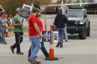 Strikers picket at one of the gates during the ongoing United Auto Workers strike at the Stellantis Toledo Assembly Complex on Wednesday, Oct. 25, 2023, in Toledo, Ohio. (Kurt Steiss/The Blade via AP)