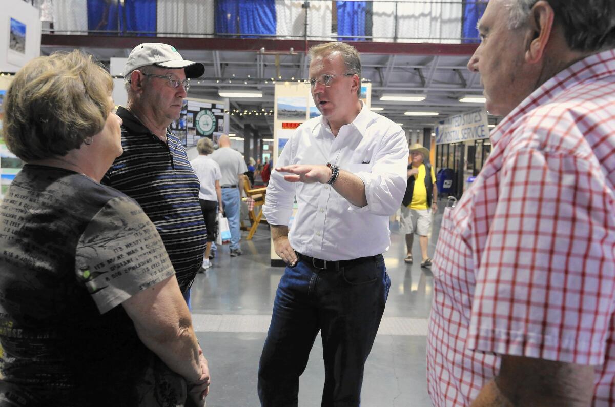 Ron Nehring, the Republican candidate for lieutenant governor, chats with visitors at the California State Fair in Sacramento in July. Nehring is running a long-shot campaign against incumbent Gavin Newsom, a Democrat.