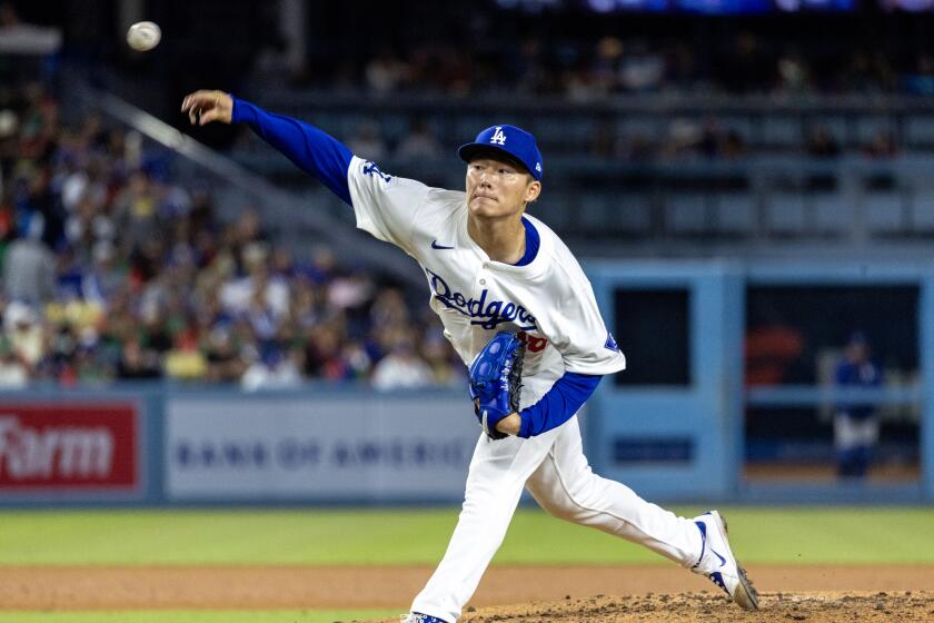 LOS ANGELES, CA - MAY 7, 2024: Los Angeles Dodgers pitcher Yoshinobu Yamamoto (18) pitches against the Miami Marlins in the seventh inning at Dodger Stadium on May 7, 2024 in Los Angeles, California.(Gina Ferazzi / Los Angeles Times)