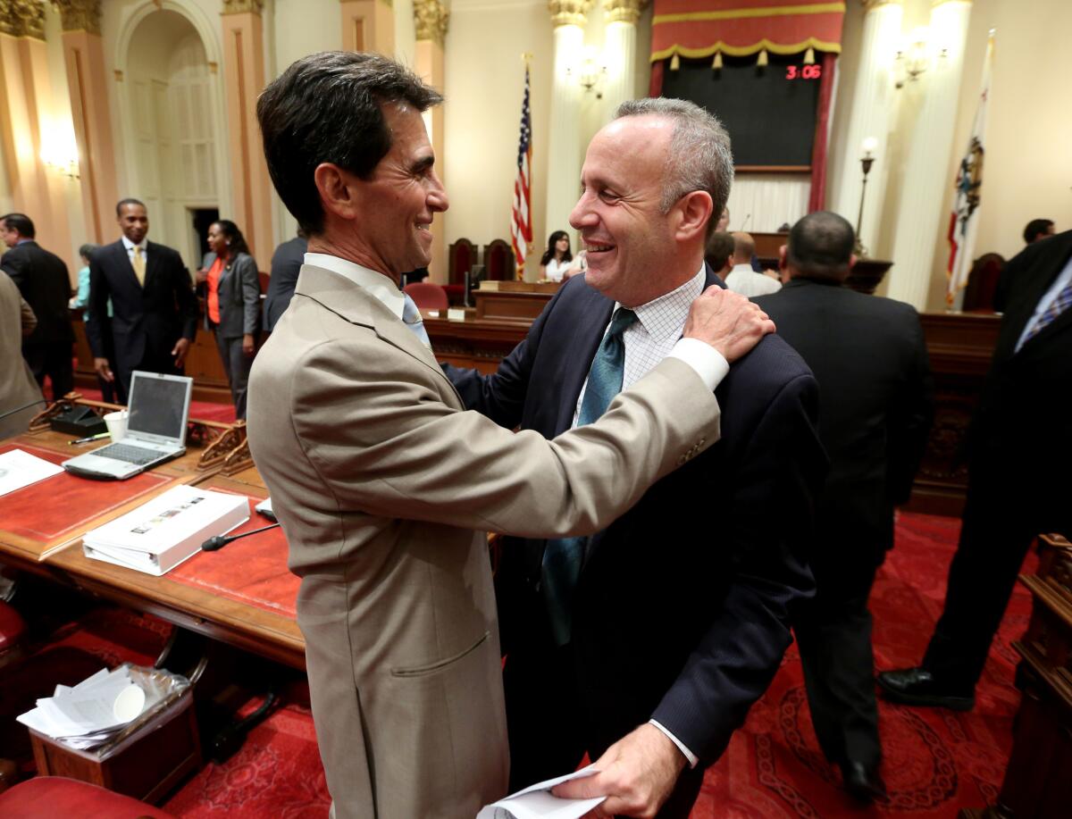 Leno with former Senate leader Darrell Steinberg on the final night of the 2014 legislative session. "He's not afraid to have a fight," said Steinberg. (Rich Pedroncelli / Associated Press)