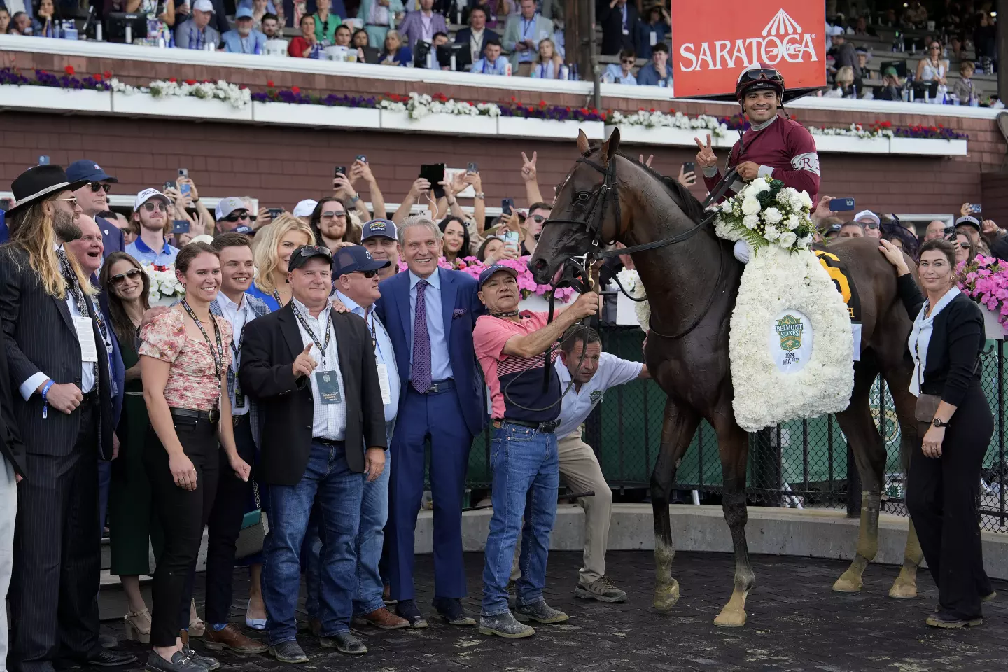 Why Jayson Werth's Unexpected Love for Horse Racing jayson Werth and a large group surrounds horse Dornoch and jockey Luis Saez in the winner's circle at the Belmont Stakes