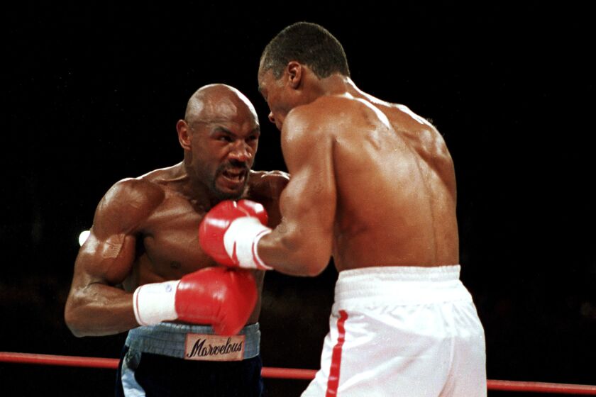 In this April 1987 photo, "Marvelous" Marvin Hagler, left, moves in on "Sugar" Ray Leonard in the third round in Las Vegas.
