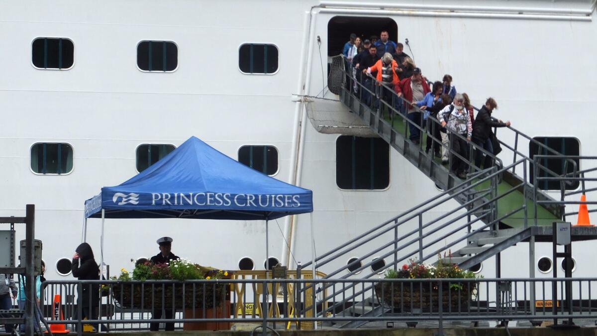 Passengers of the Princess Cruises ship disembark Wednesday in Juneau, Alaska, hours after arriving at port.