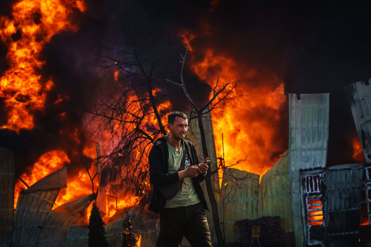 A building is hit by Russian shelling Friday in Kharkiv, Ukraine.