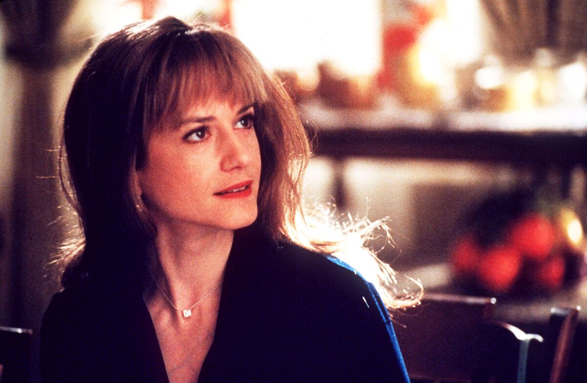 Holly Hunter looks to the side while smiling in a scene from "Home for the Holidays."