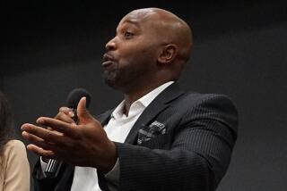 Jay Bowser speaks at a panel discussion in 2019.