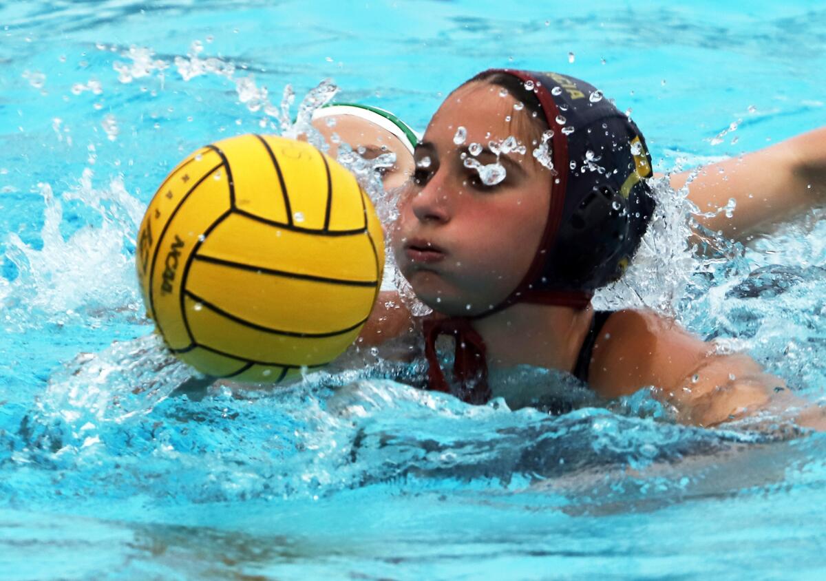 Estancia's Nataly Andriashvili (7) tries to get control of the ball against rival Costa Mesa during Wednesday's match.