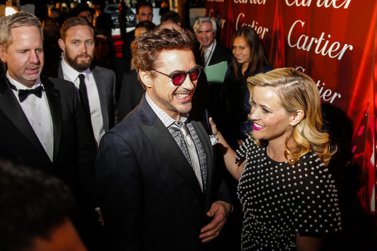 Robert Downey Jr. and Reese Witherspoon on the red carpet at the Palm Springs International Film Festival awards gala on Jan. 3, 2015.