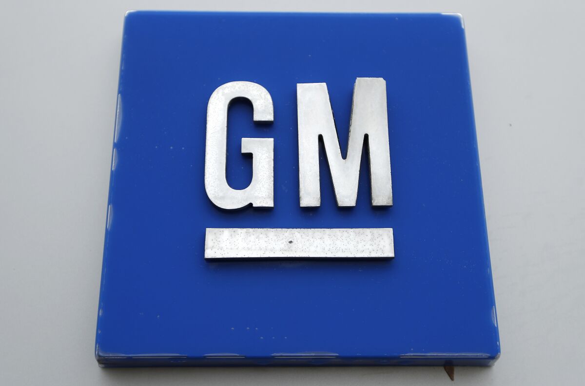 This Jan. 27, 2020 photo shows the General Motors logo. Vehicles were scarce due to a global shortage of computer chips, but that drove prices up and helped General Motors increase its net income 56% last year. The Detroit automaker said Tuesday, Feb. 1, 2022 that it made $10.02 billion for the full year. And it predicted record pretax earnings in 2022 of $13 billion to $15 billion and net income of $9.4 billion to $10.8 billion.(AP Photo/Paul Sancya)