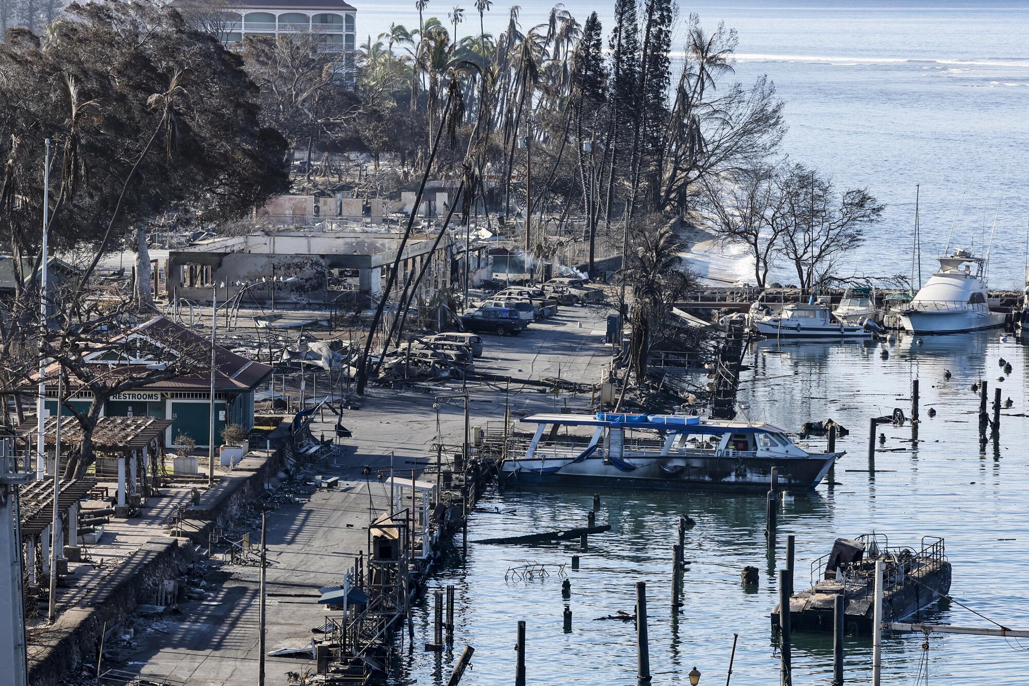 Watercraft bear the scars of Tuesday's wildfire near downtown Lahaina. 