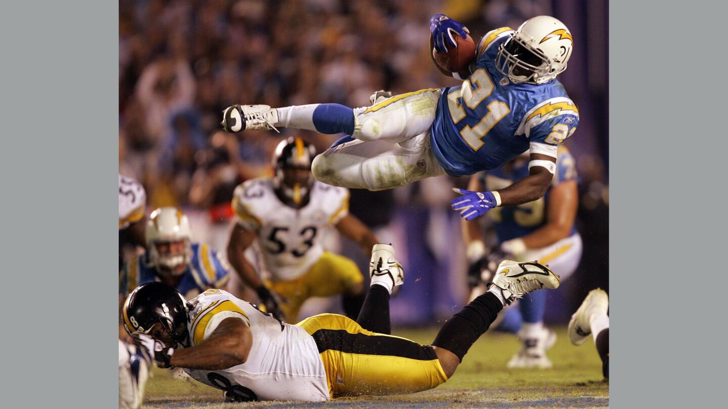 LaDainian Tomlinson of the San Diego Chargers gets tripped up during the 4th qtr against the Pittsburgh Steelers at Qualcomm Stadium on Thursday, Oct. 8, 2006.