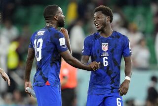 United States' Shaq Moore (18) and Yunus Musah celebrate after defeating Iran in the World Cup group B soccer match between Iran and the United States at the Al Thumama Stadium in Doha, Qatar, Tuesday, Nov. 29, 2022. (AP Photo/Ashley Landis)