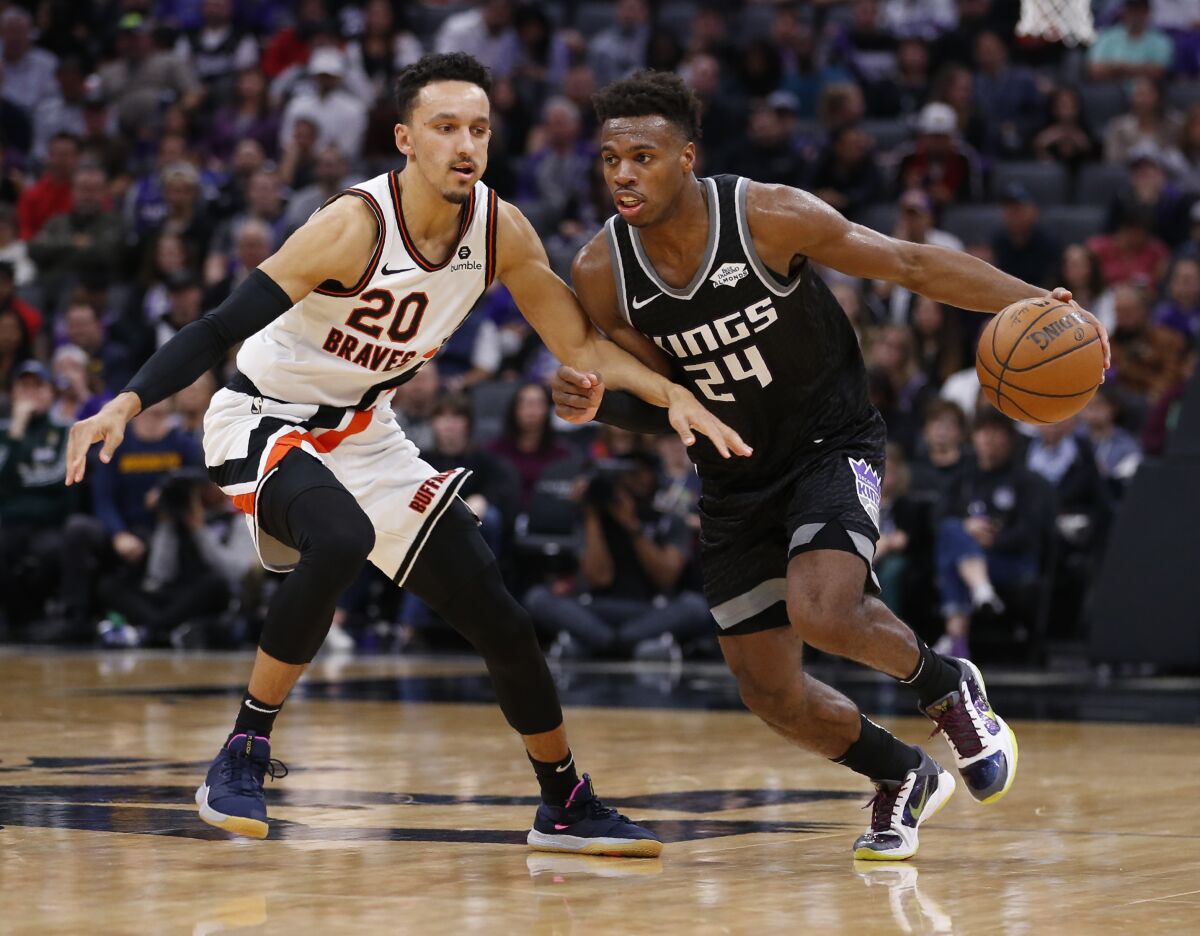 Clippers guard Landry Shamet defengs Kings guard Buddy Hield during the second half of a game Dec. 31.