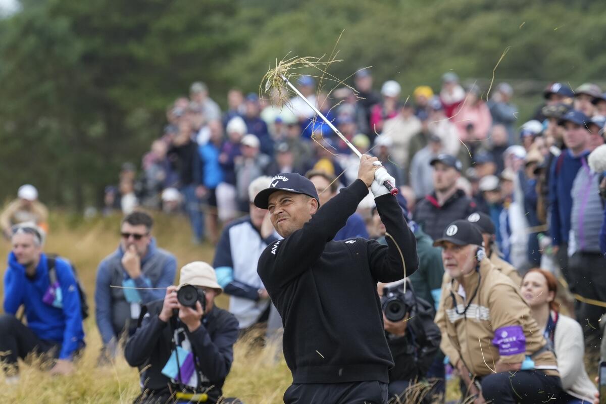 Xander Schauffele plays a shot from the rough on the 12th hole during the final round of the British Open on Sunday.