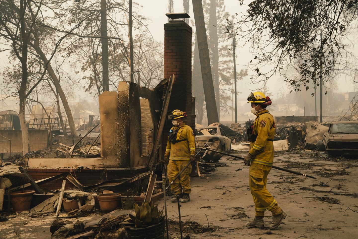 Fire crews put out hot spots in Paradise, Calif.