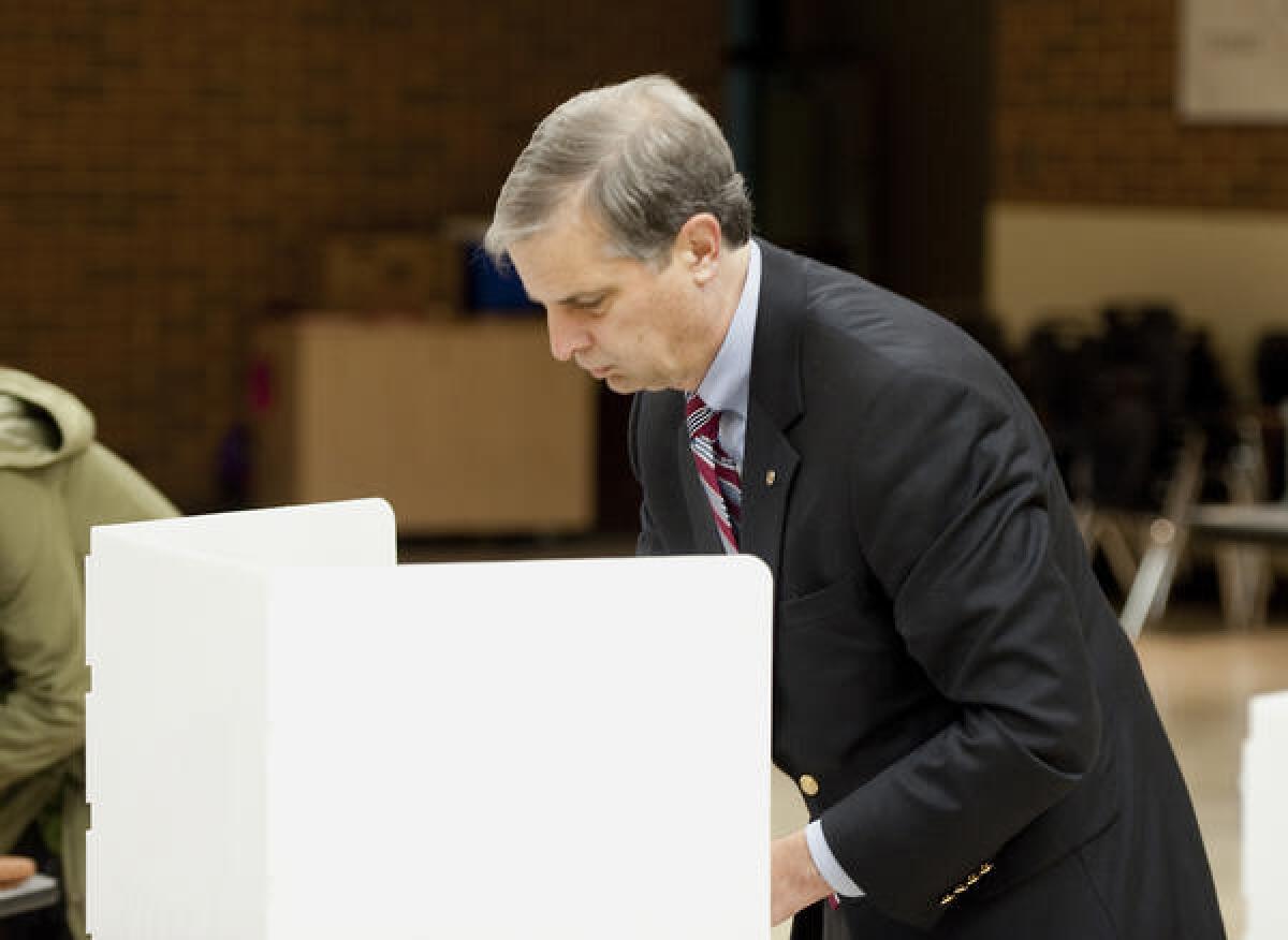 Harrisonburg Sen. Mark Obenshain, Republican candidate for attorney general, marks his ballot in Virgina.