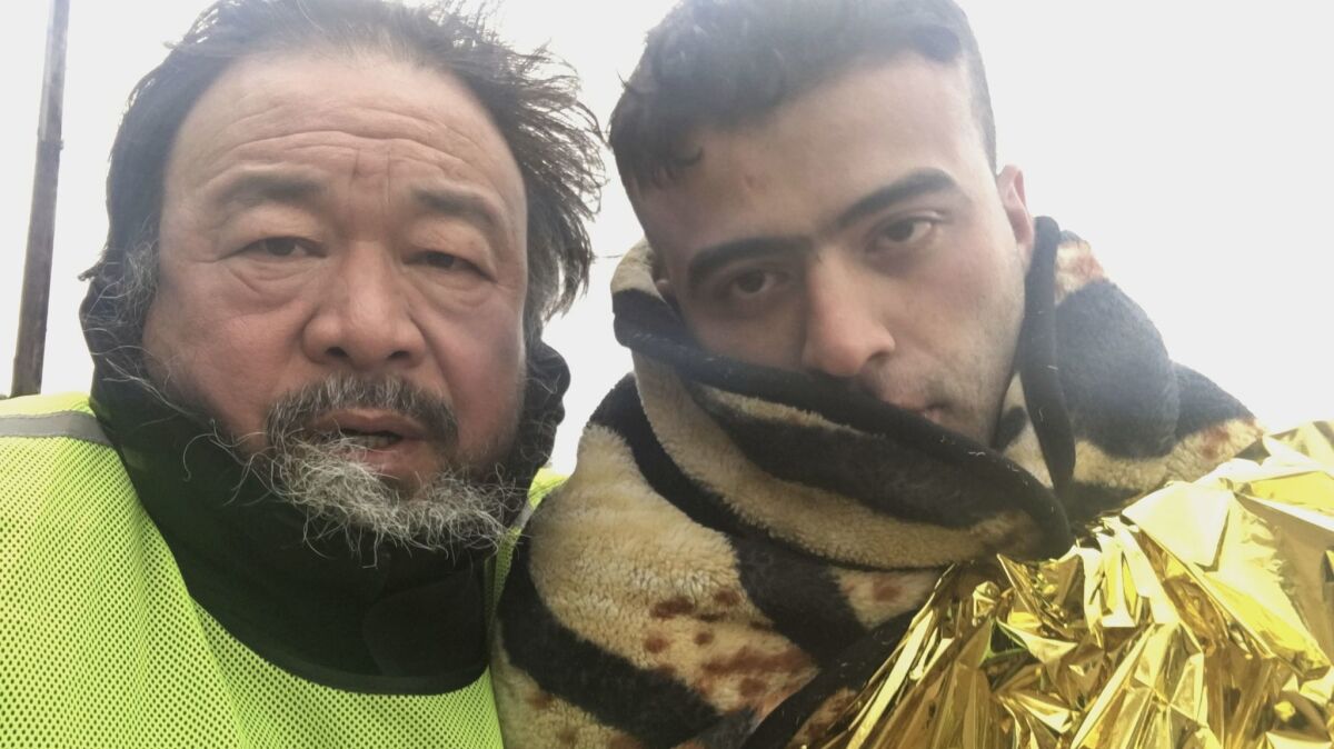 Ai Weiwei with Muhammed Hassan from Iraq on Lesvos Island in Greece, from the documentary "Human Flow."
