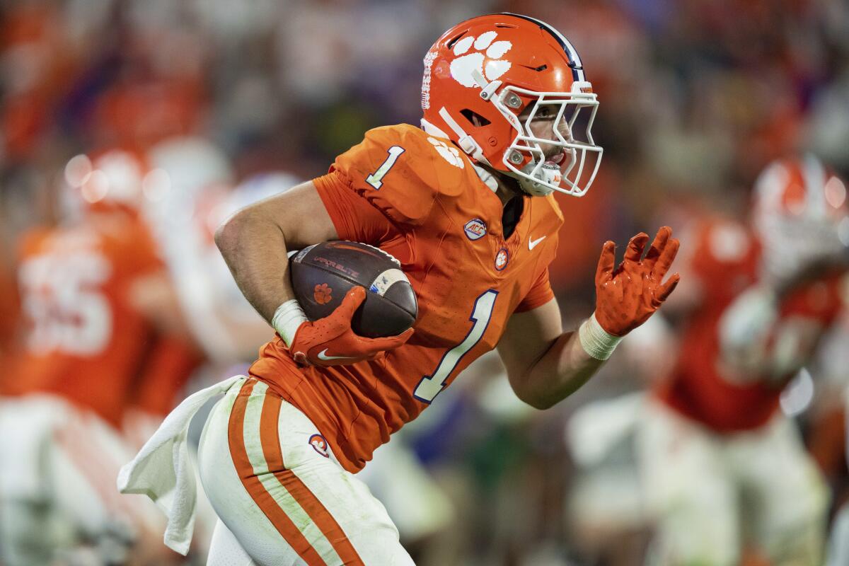 Clemson running back Will Shipley runs with the ball during the second half of an NCAA college football game against North Carolina, Saturday, Nov. 18, 2023, in Clemson, S.C. (AP Photo/Jacob Kupferman)